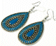 Boucles d'oreilles pendantes en metal argente cisele serties de pierres bleu-vert