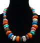 Collier ethnique artisanal imitation pieces spheriques en tagua agencees de pierres difformes multicolore