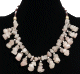 Collier ethniques artisanal imitation pierres marbrees suspendues agrementees de perles multicolores