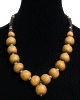 Collier ethnique artisanal imitation pierres rondes jaunes agrementees de perles argentees et noires