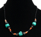 Collier ethnique artisanal imitation trois pierres difformes agencees de perles multicolores