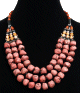 Collier ethnique artisanal trois rangs imitation corail et perles agencees de pieces argentees ciselees